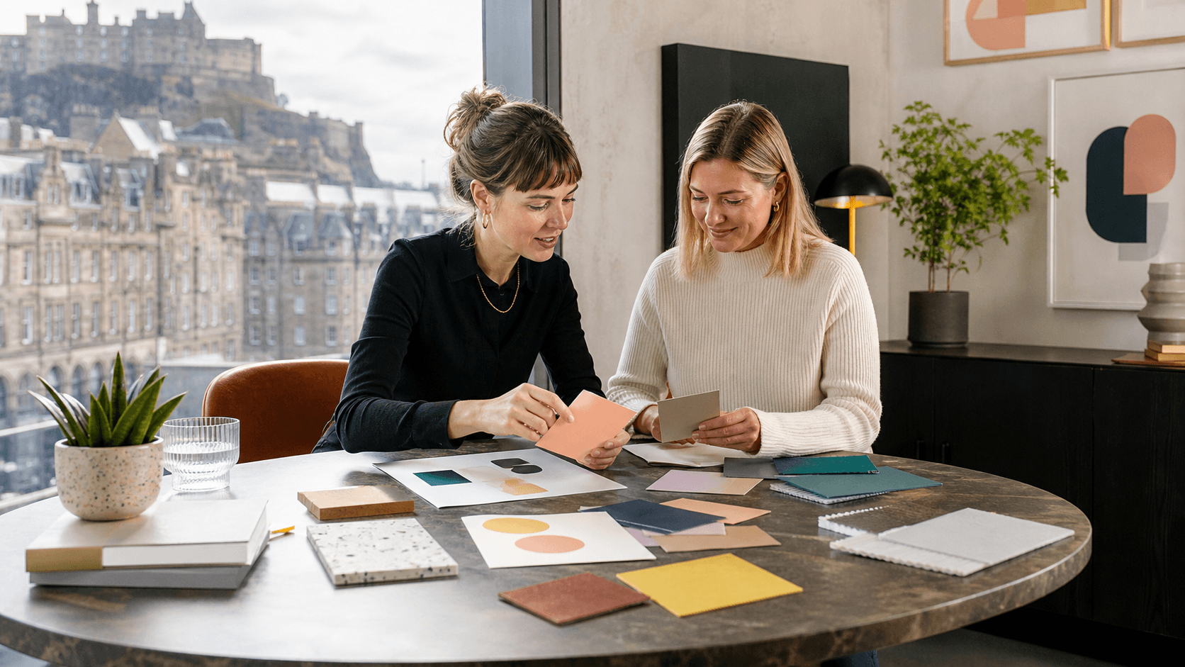 Elegant UK workspace with notebook, coffee, and branding materials in soft blue and gold light.